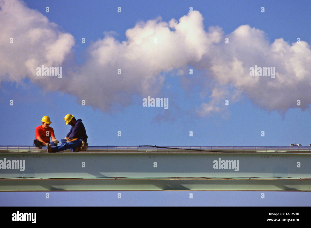 Pipefitters working on chemical pipes on top of steel beams near Hannibal Missouri USA Stock Photo