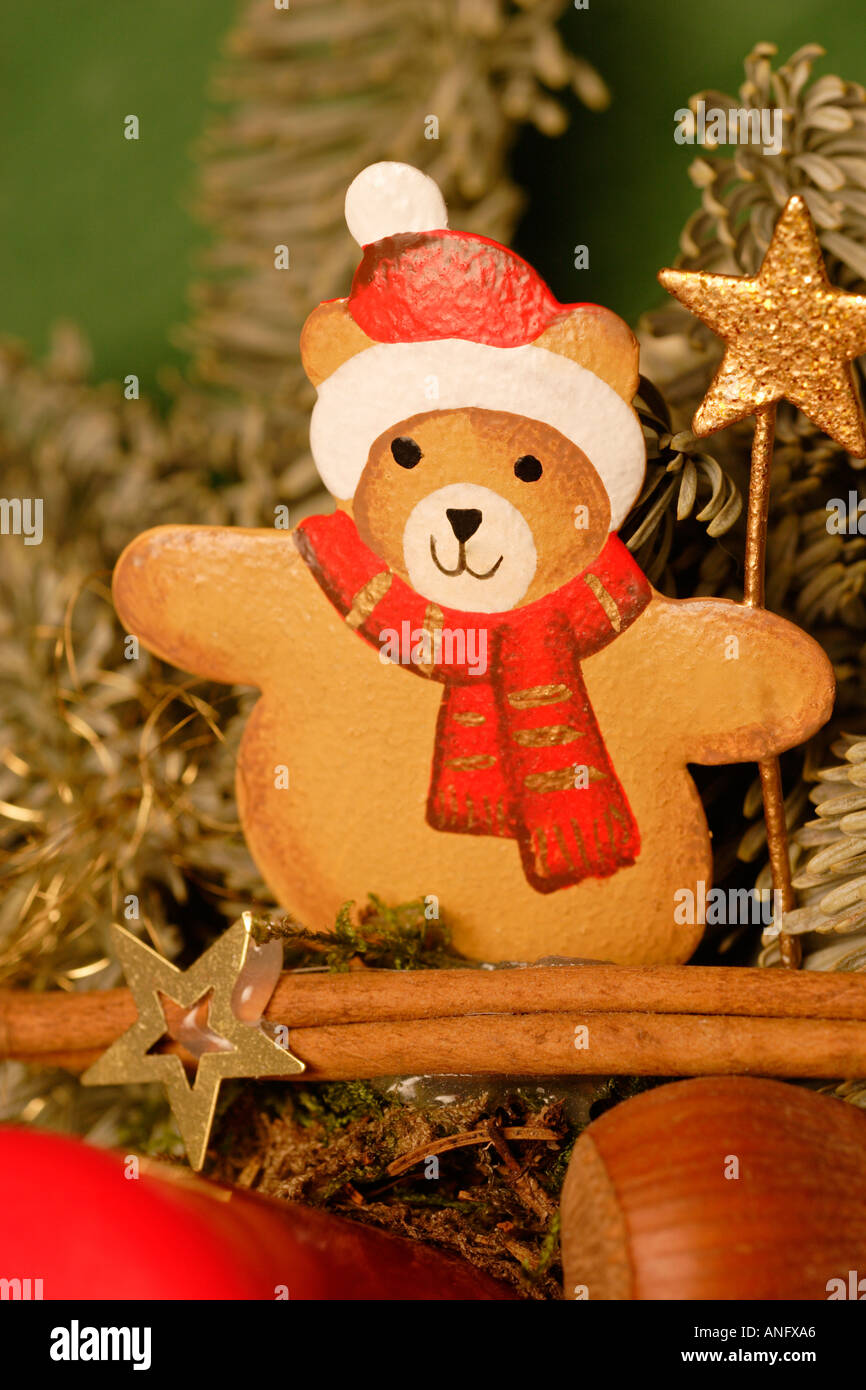 Christmas arrangement teddy bear figure in Santa Claus costume with conifer branches Stock Photo