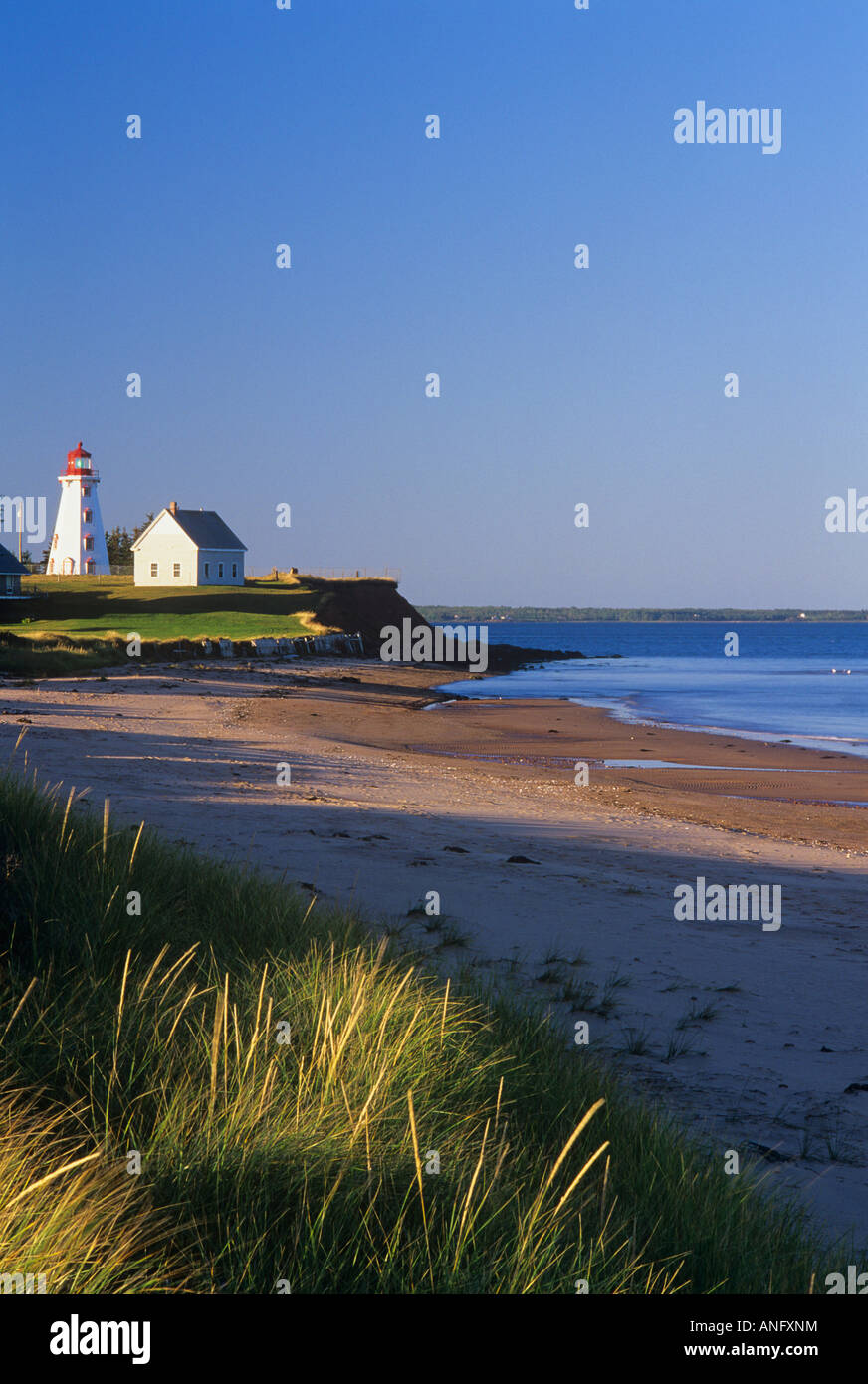 Lighthouse at low tide in Panmure Island Provincial Park, Prince Edward Island, Canada Stock