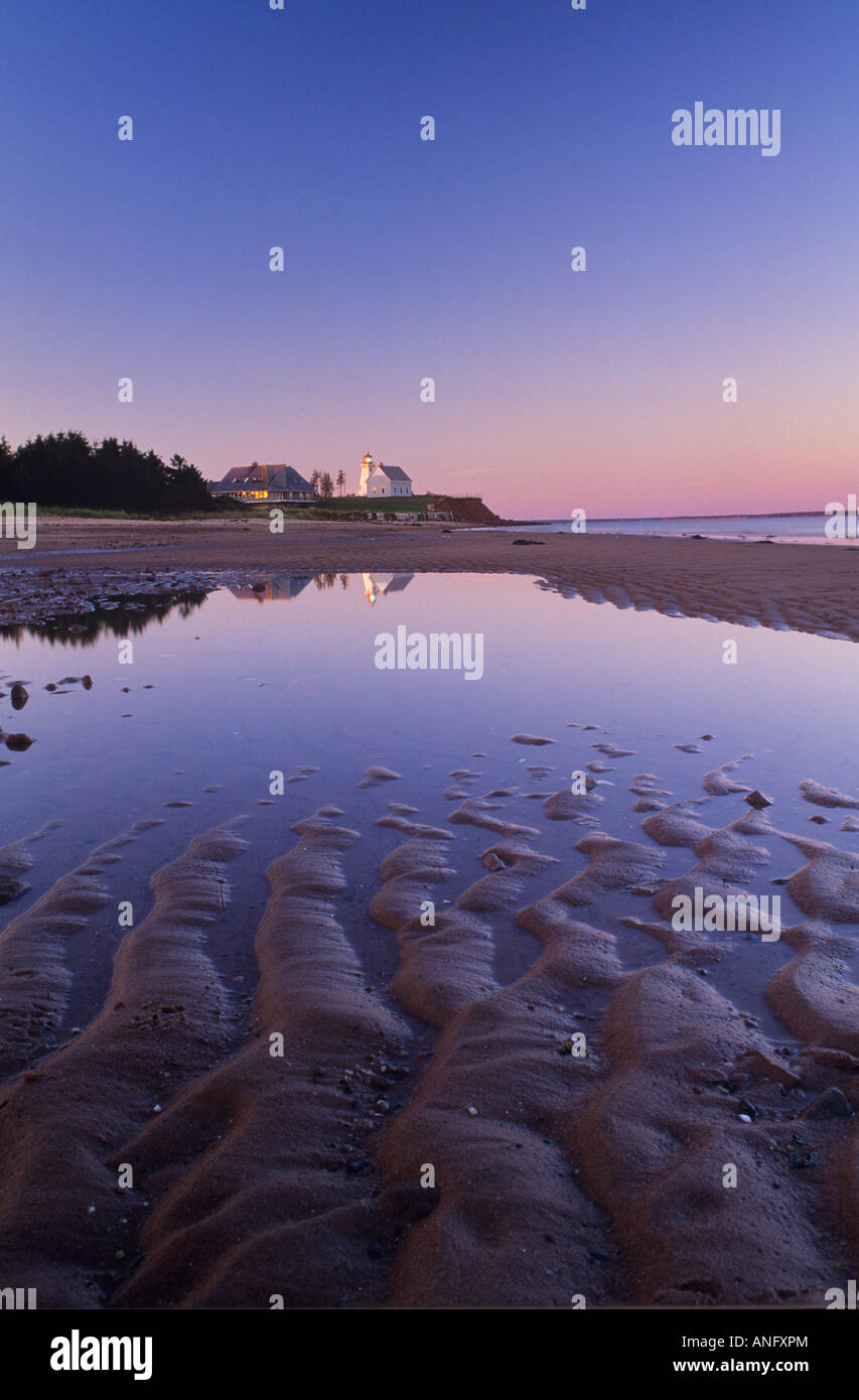 Lighthouse at low tide in panmure island provincial park hires stock