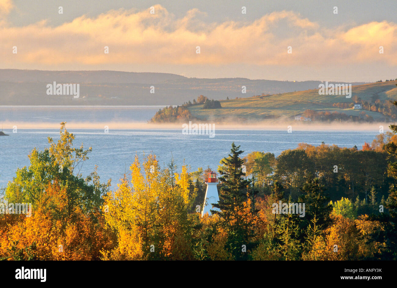 Early morning fog lifting off Bras d'Or Lake, Baddeck, Cape Breton