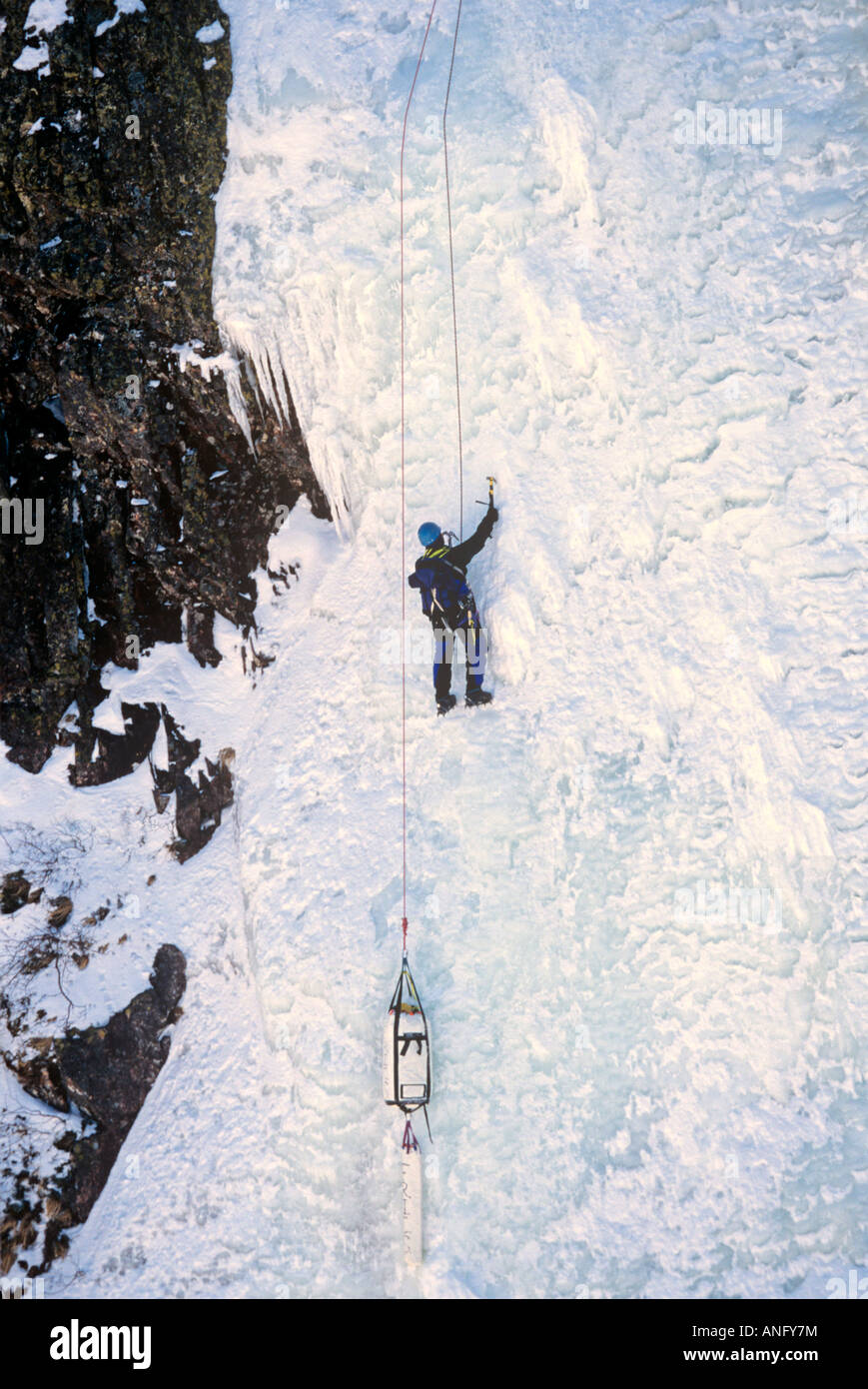 Ice Climbers scaling iced wall of Baker's Brook Pond, Gros Morne National Park, UNESCO, World Heritage Site, Newfoundland, Canad Stock Photo