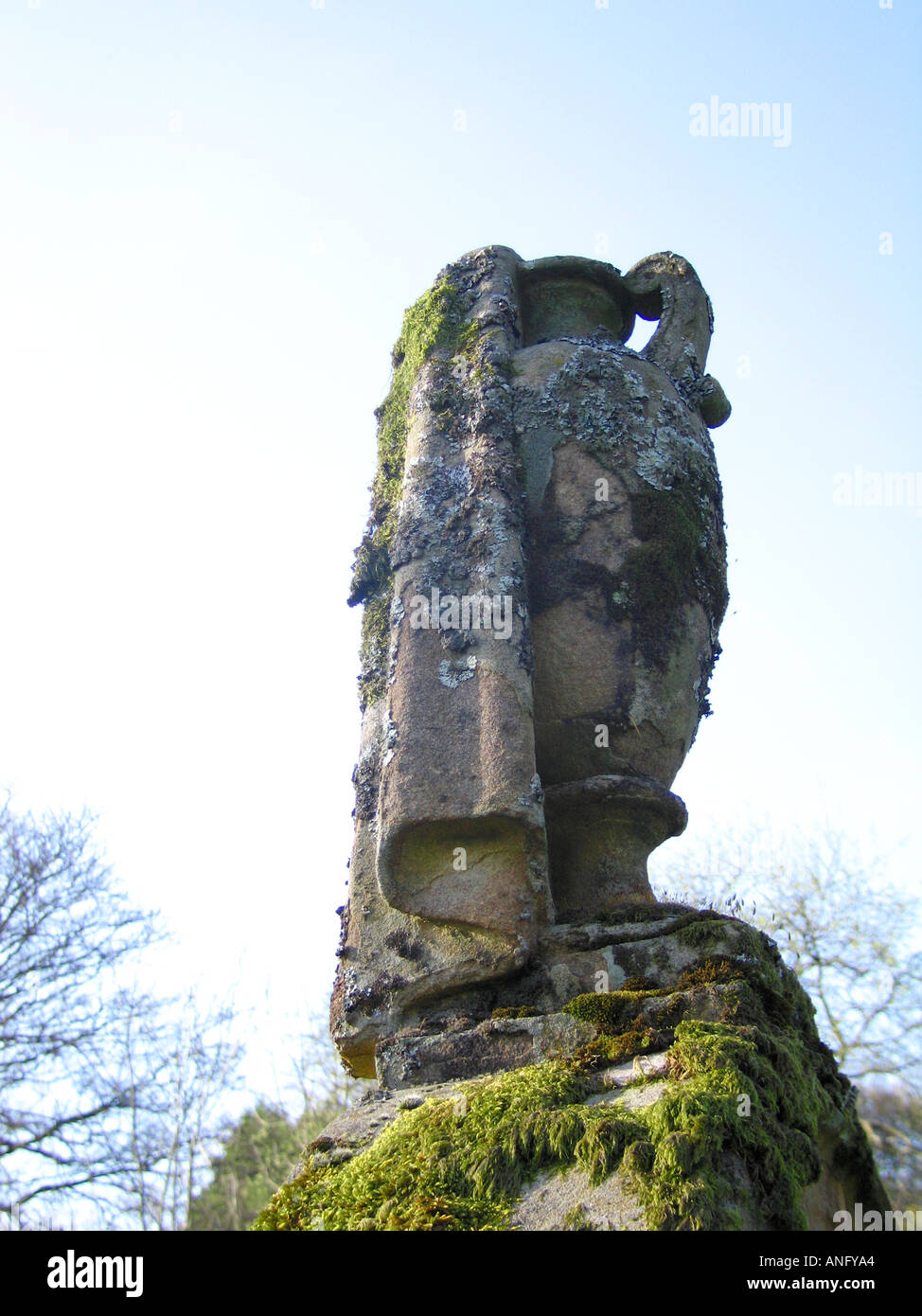 Stone urn on top of grave stone Stock Photo