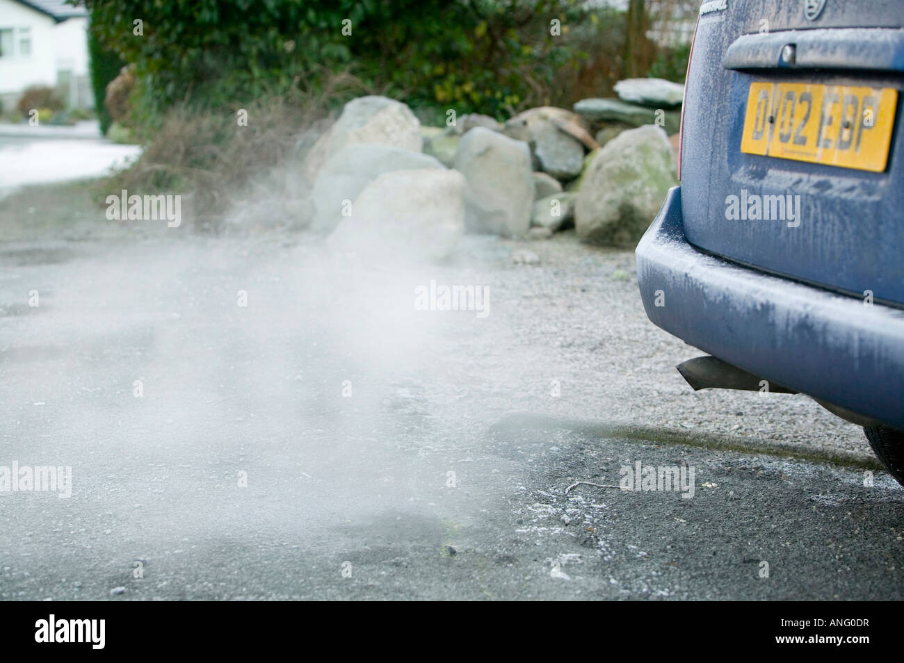 A car exhaust pipe emmitting exhaust fumes Stock Photo Alamy