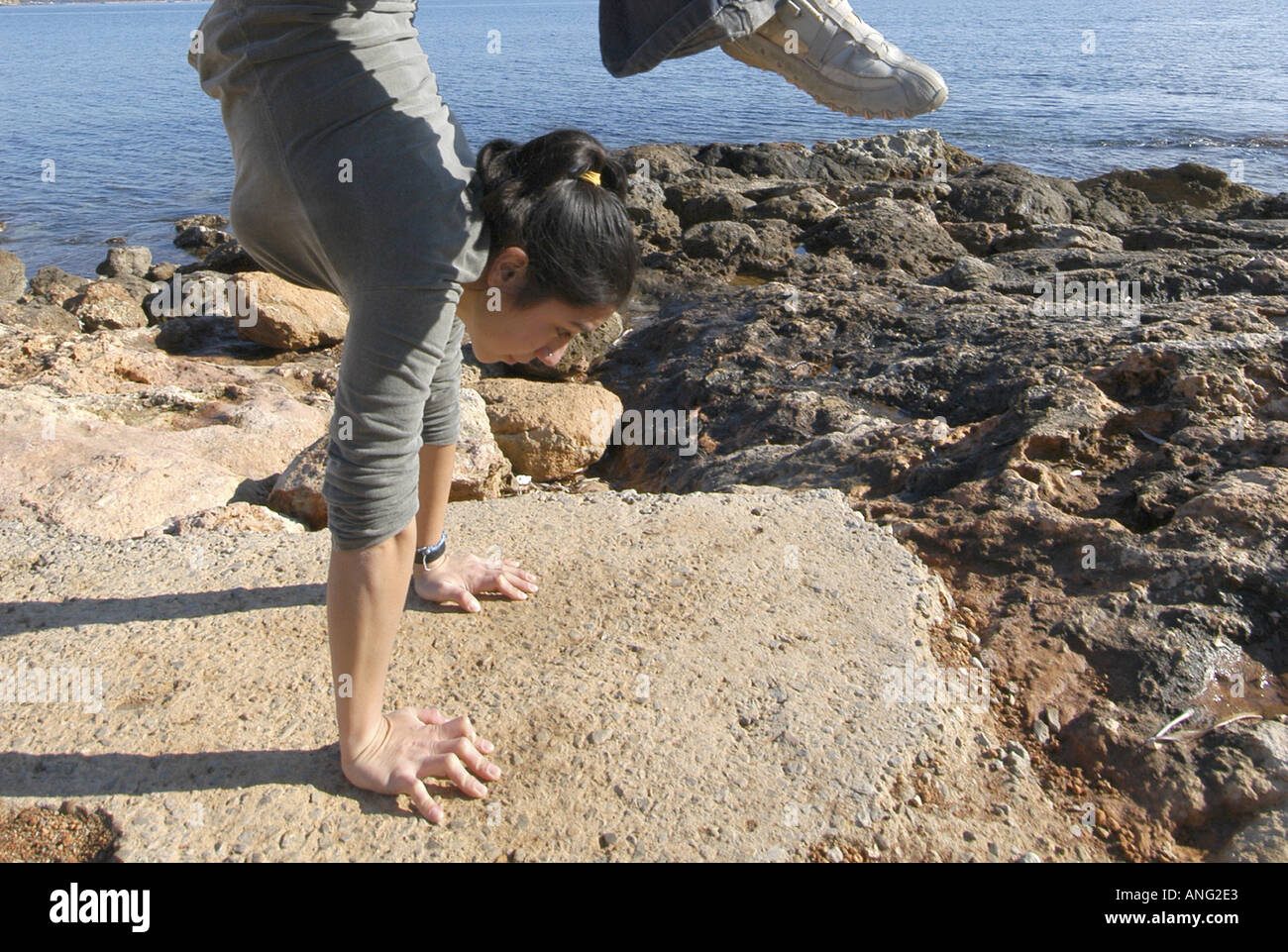 Mixed race young woman half asian half spanish exercising oudoors and