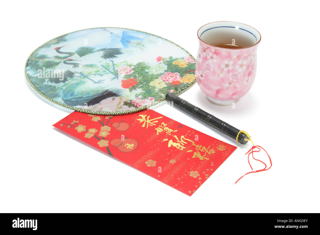 Cup of Chinese Tea with Fan and Red Packet Stock Photo - Alamy