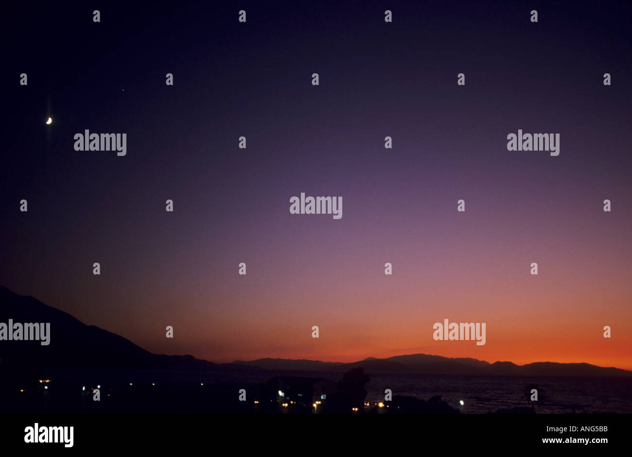 Turkey Guzelcamli A Sunset And A Quarter Moon On The Surrounding Mountains Stock Photo