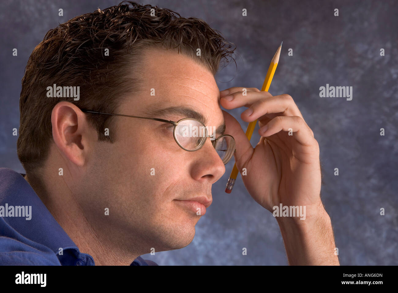 Man thinking writing listening to a lecture Stock Photo