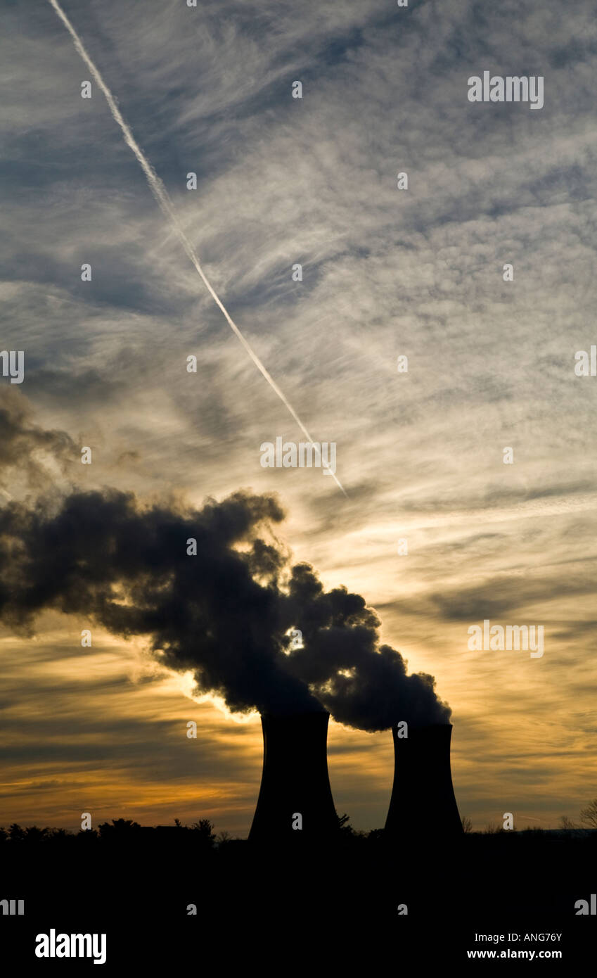 two cooling nuclear plant cooling towers at sunset Stock Photo - Alamy