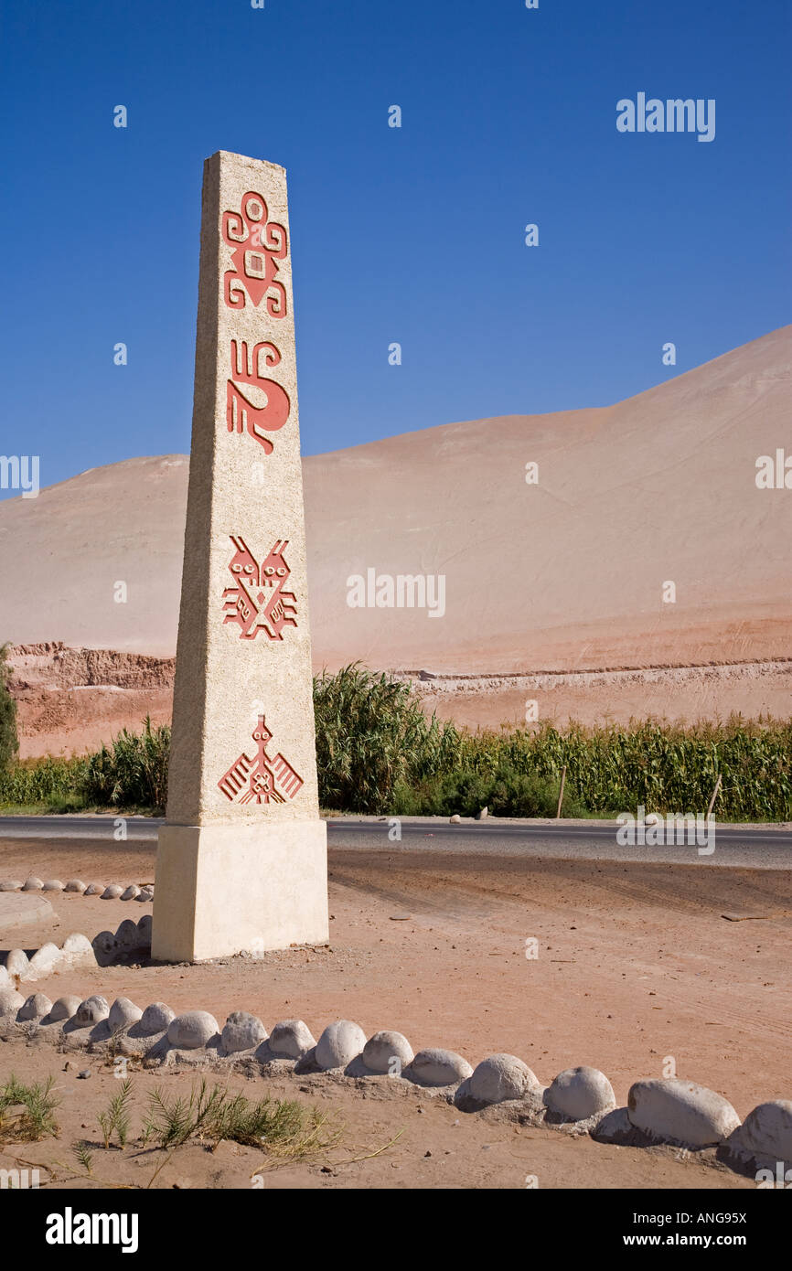 Marker post indicating geoglyphs on hillside Chile near Arica Stock Photo