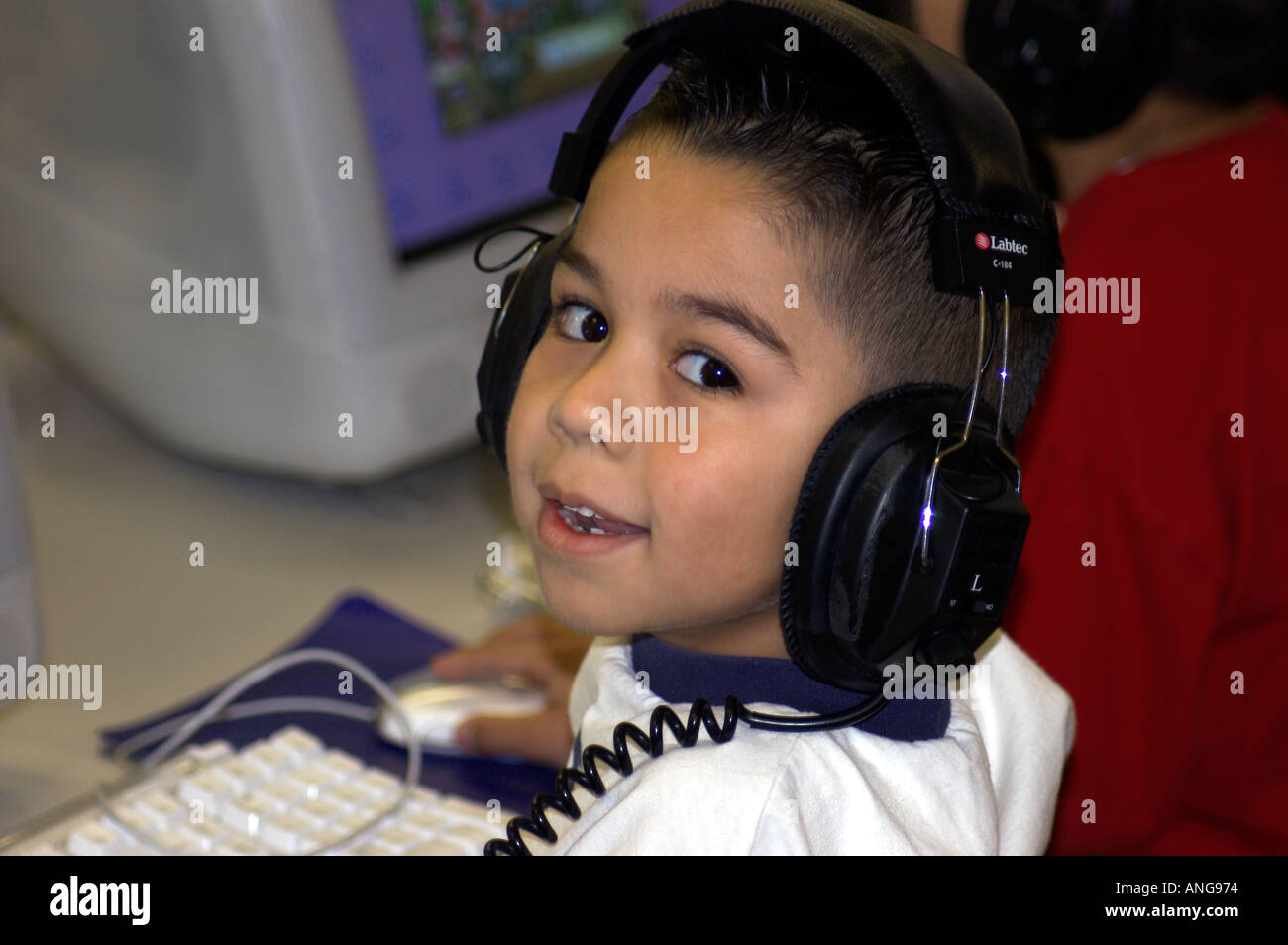 Hispanic boy at computer Stock Photo - Alamy