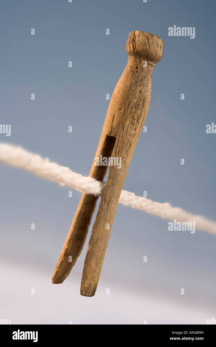 An old fashioned wooden clothes pin on a line Stock Photo
