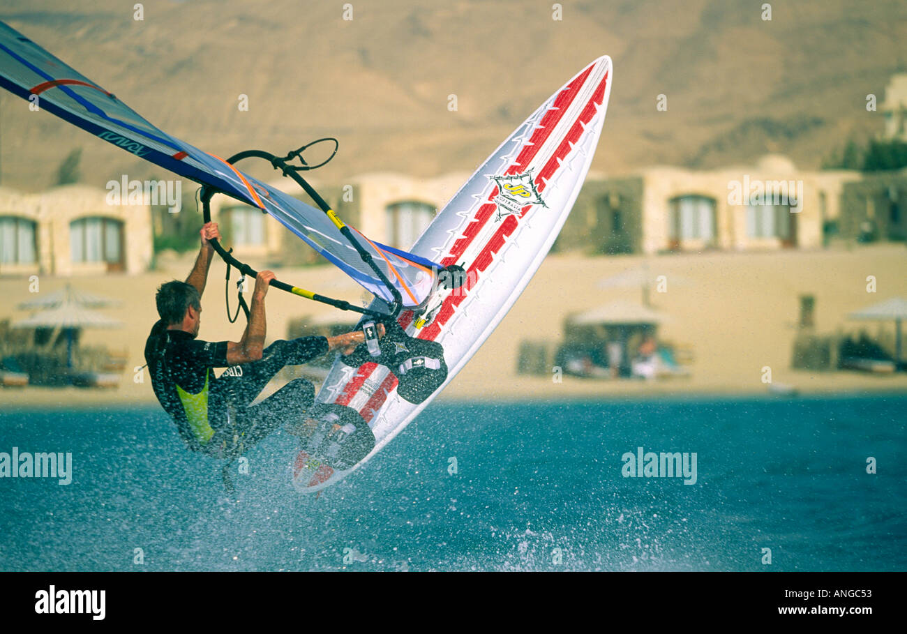 Chopping Wave single male windsurfer jumping on chop waves Red Sea Sinai Egypt Stock ...
