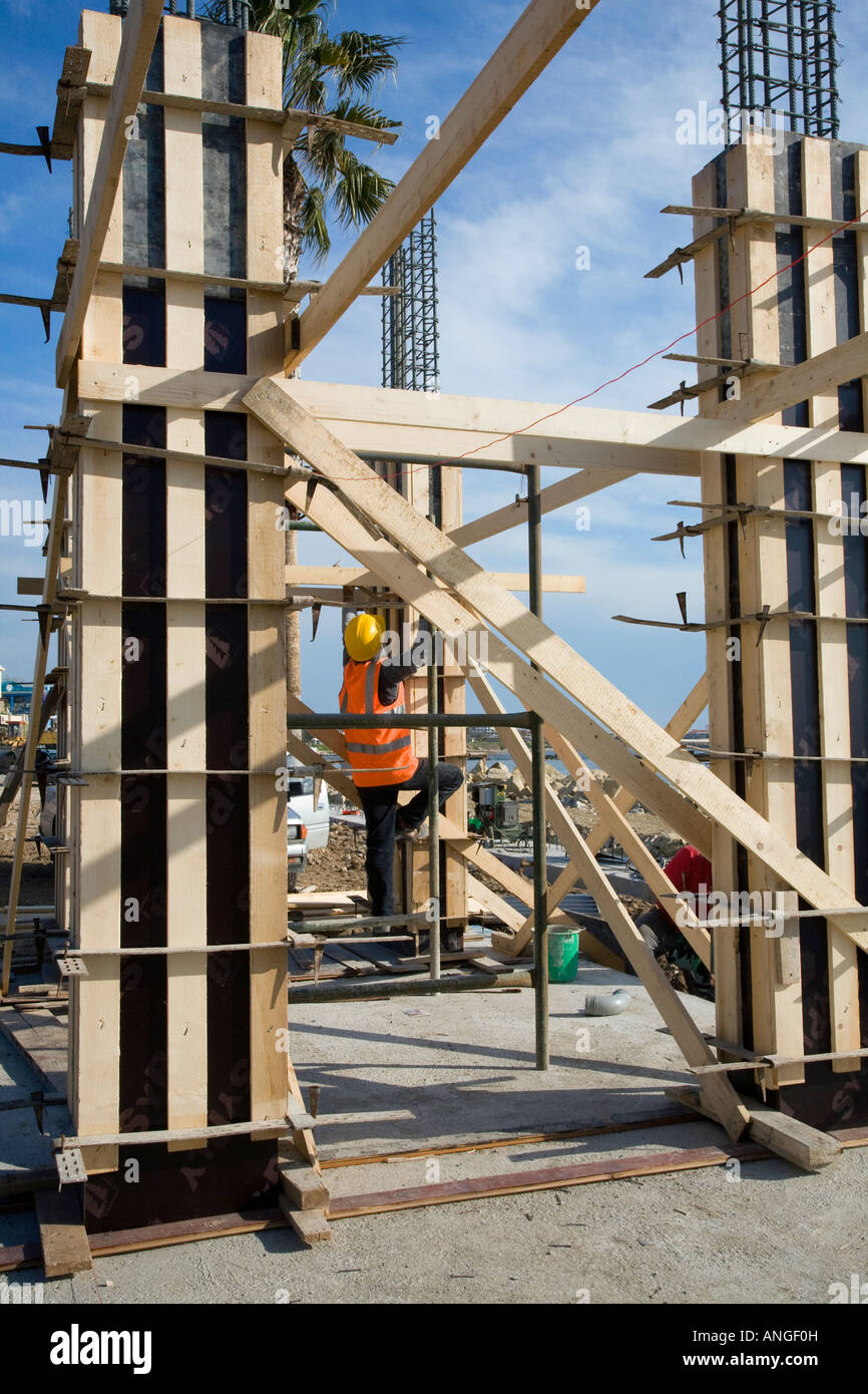 Workmen erecting Steel Shuttering, and concrete reinforcing on building
