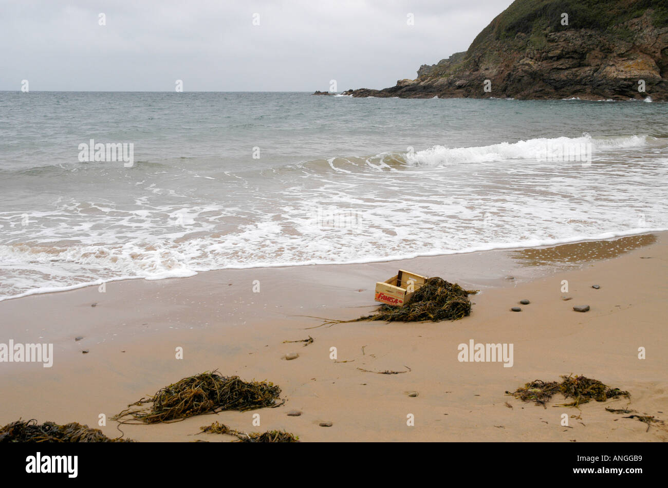 Empty wooden crate washed up on the sea shore at Greve De Lecq in northern  Jersey Stock Photo - Alamy