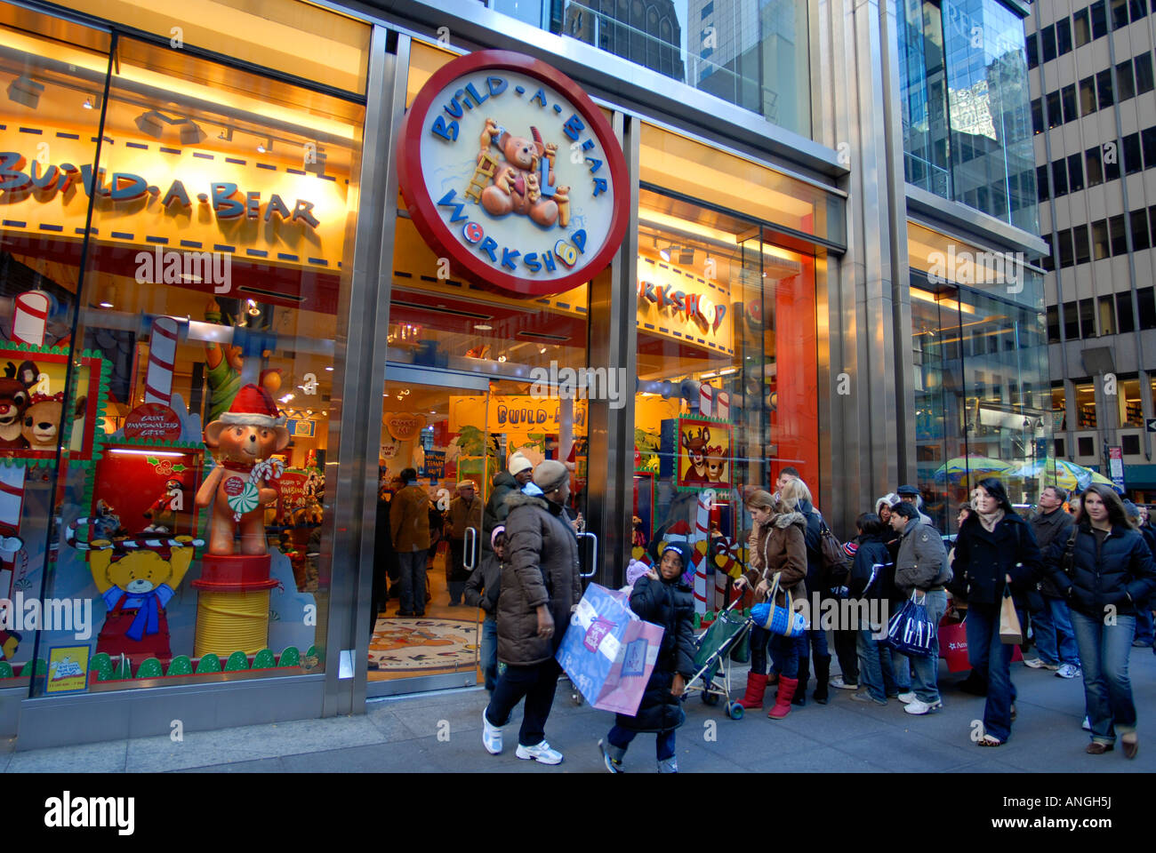 Hordes of shoppers ion Fifth Avenue in NYC outside of Build A Bear Workshop on Black Friday the day after Thanksgiving Stock Photo