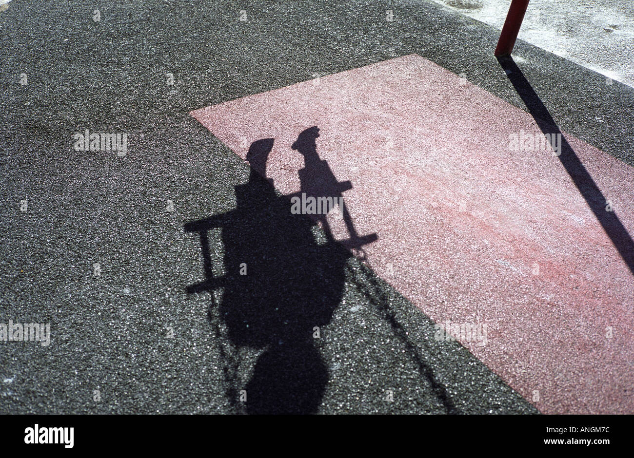 shadow of a child on a swing Stock Photo
