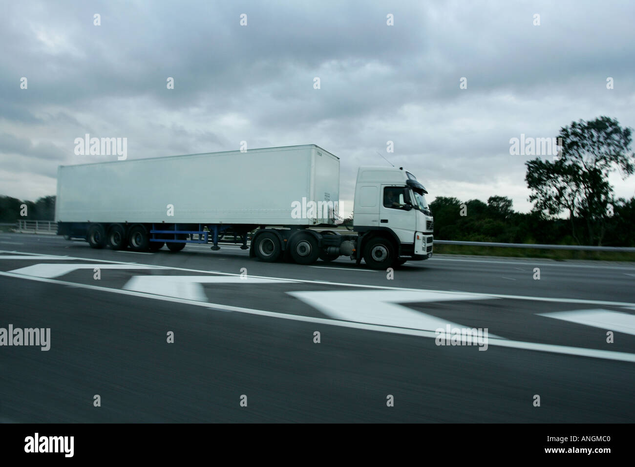 White  lorry with no advertising on driving on the motorway Stock Photo
