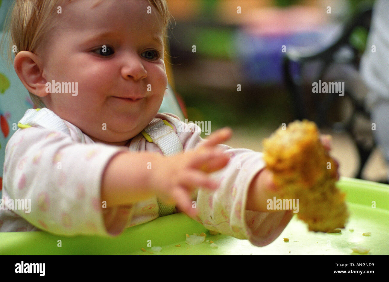 baby girl eats corn on the cob Stock Photo Alamy