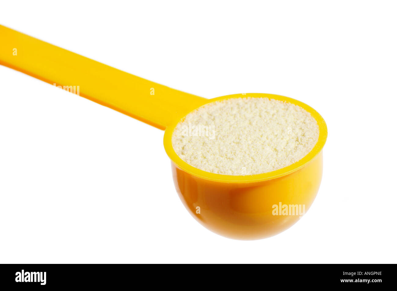 baby milk formula powder in mearuring scoop on white background ANGPNE