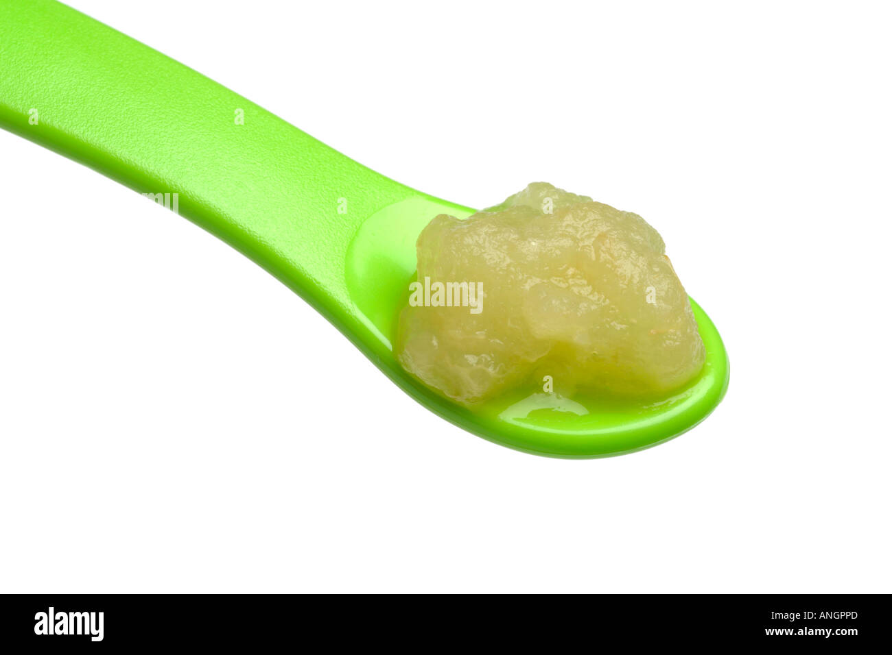 First stage weaning food for babies apple puree on weaning spoon Stock Photo