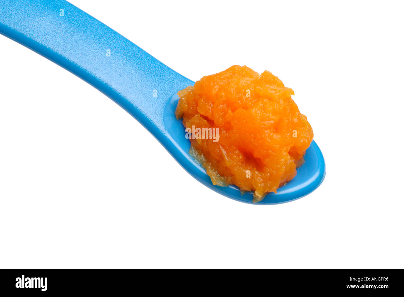 Weaning food for babies pureed carrot on weaning spoon Stock Photo