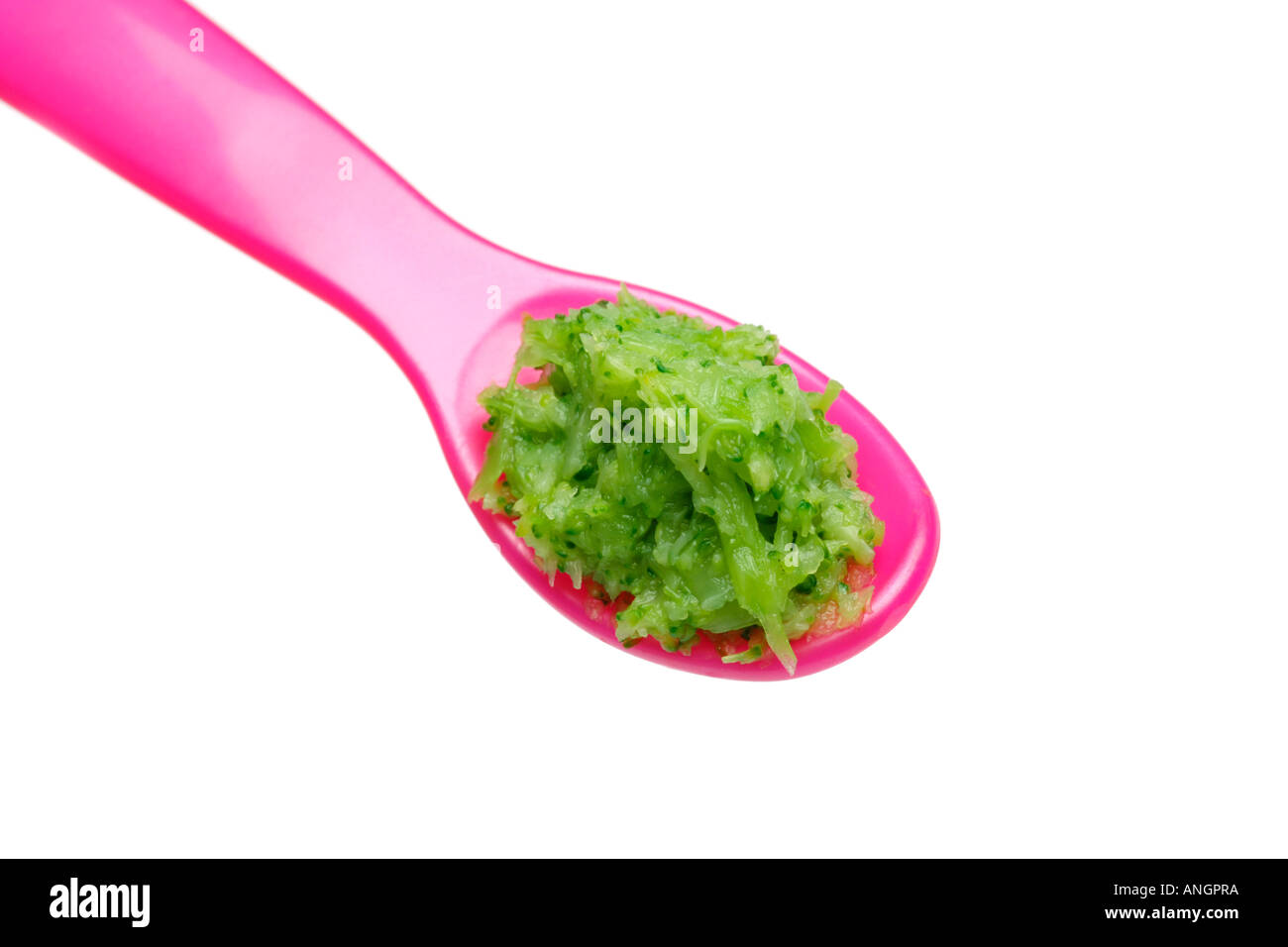 Early weaning food for babies broccoli puree on weaning spoon Stock