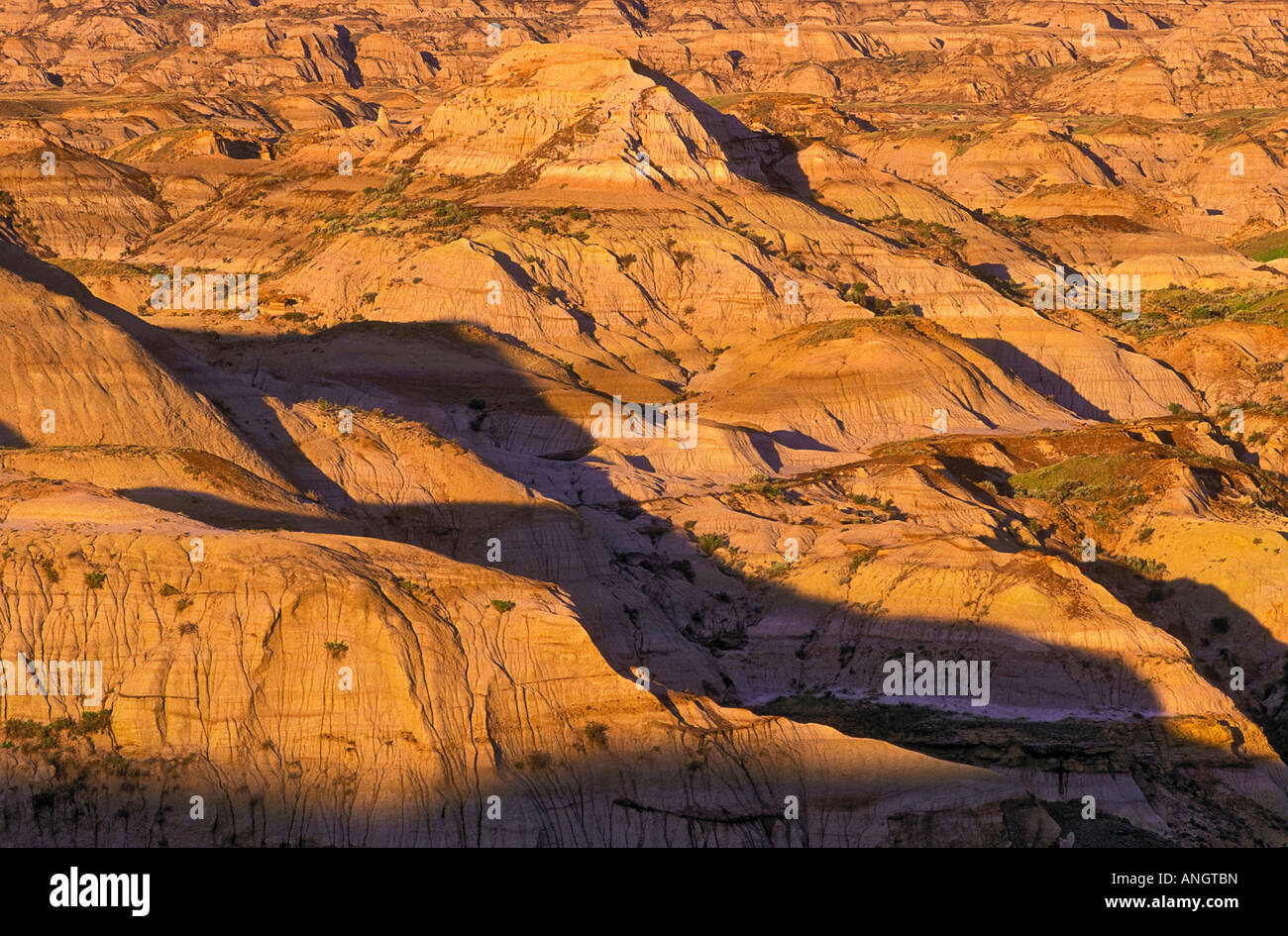 Sandstone hills carved from melting ice water from the last ice age about 13,000 years ago form part of the badland topography o Stock Photo