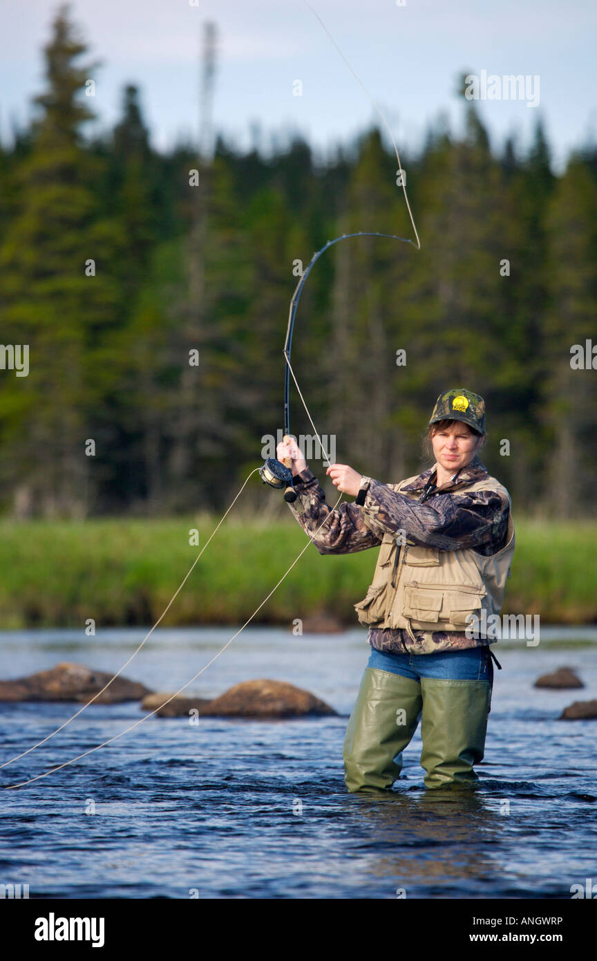 Woman fly fishing in Salmon River near the town of Main Brook, Viking  Trail, Great Northern Peninsula, Newfoundland & Labrador Stock Photo - Alamy
