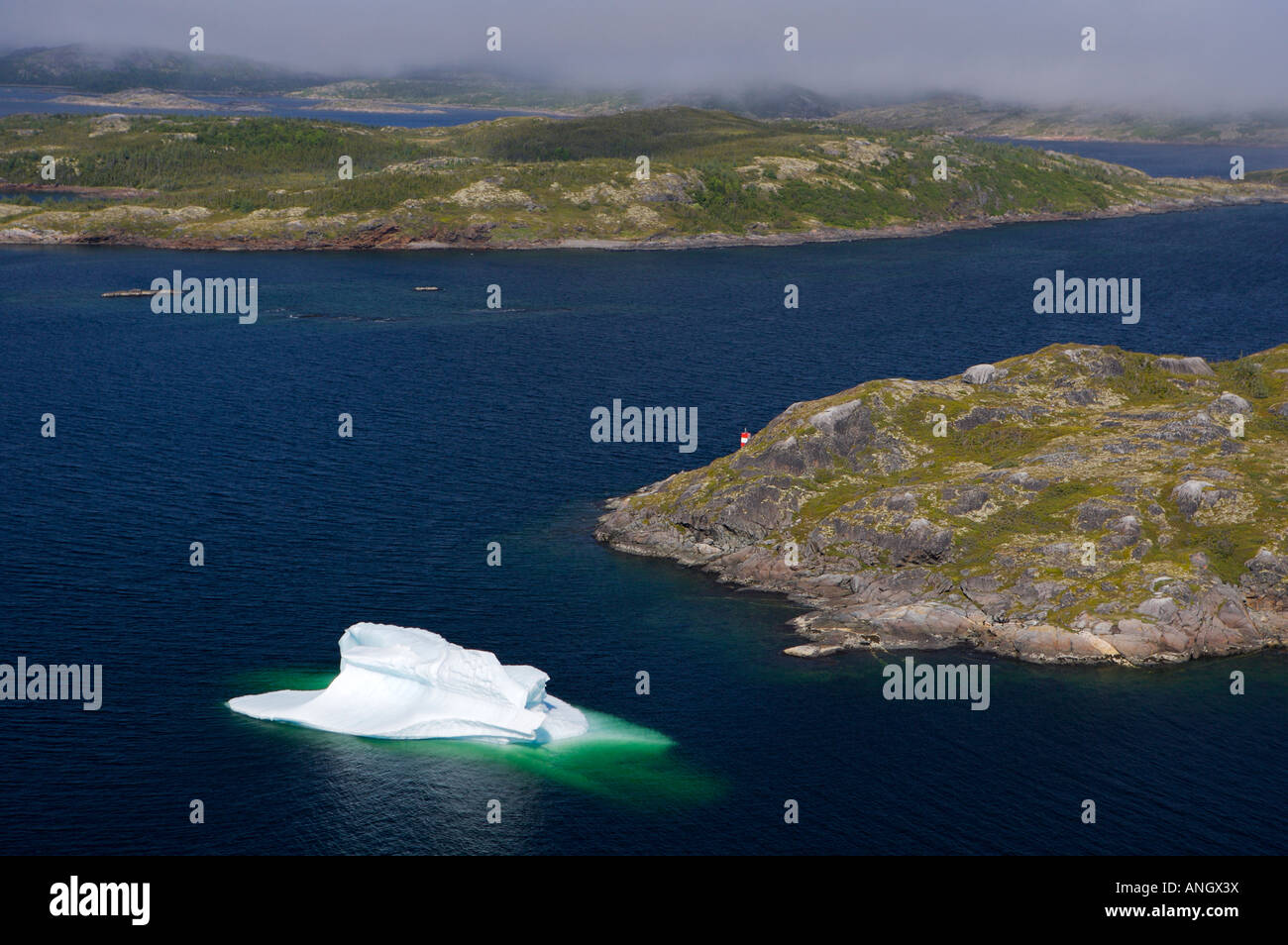 Aerial view an iceberg in bay along the coast of Southern Labrador near