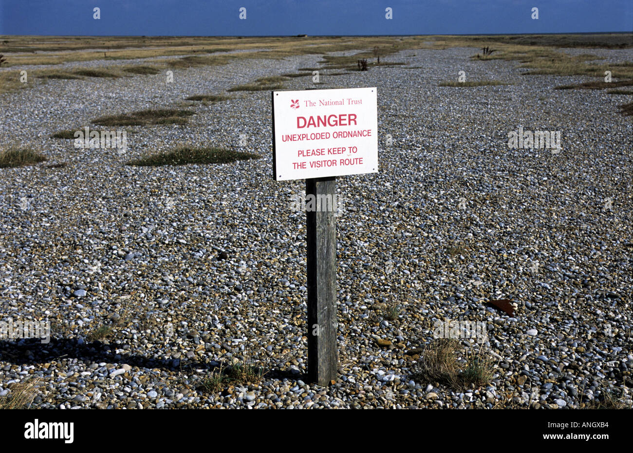 'Danger Unexploded Ordinance' sign on Orfordness, Suffolk, UK. Stock Photo