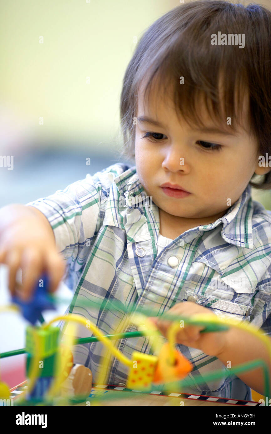 21 month old boy playing at the daycare, Montreal, Quebec, Canada Stock