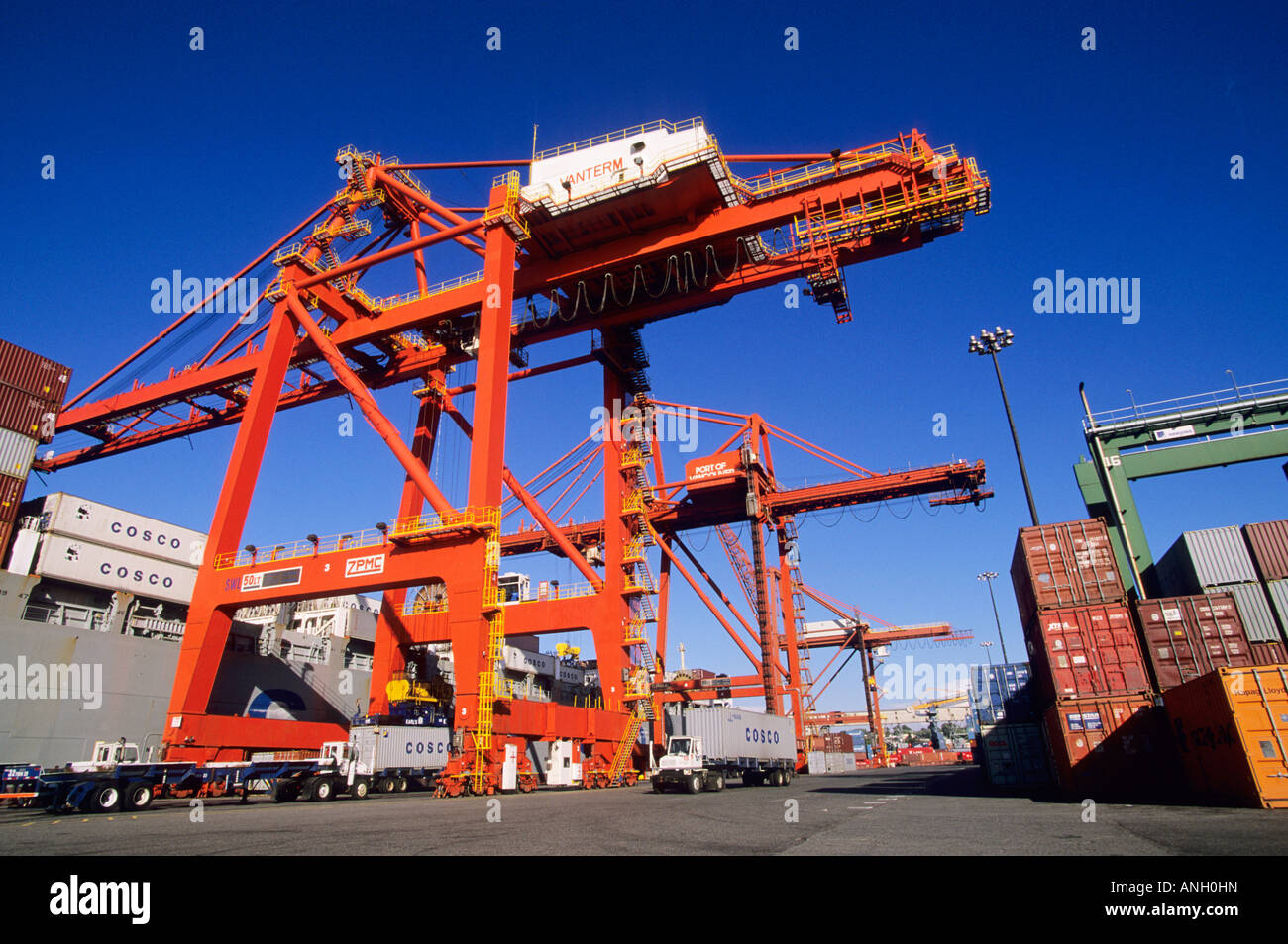 Terminal, Dock crane unloading a container ship, Port of Vancouver, British Columbia, Canada. Stock Photo