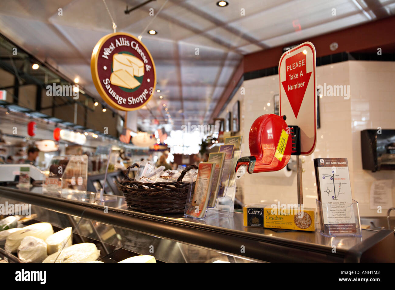 WISCONSIN Milwaukee Number dispenser at cheese and sausage shop in Milwaukee Public Market