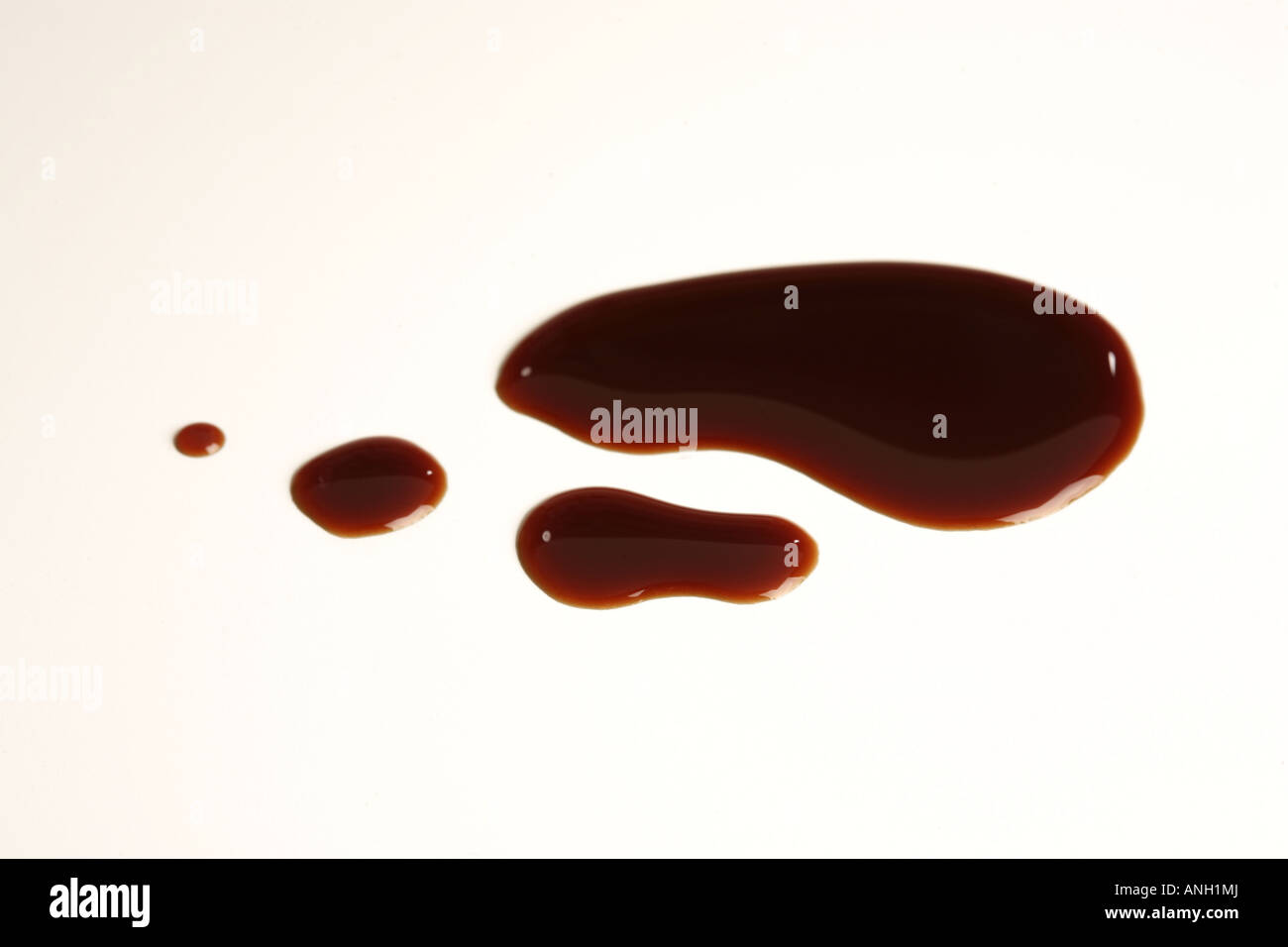 A cutout shot of a splash of soy sauce, against a white background Stock Photo