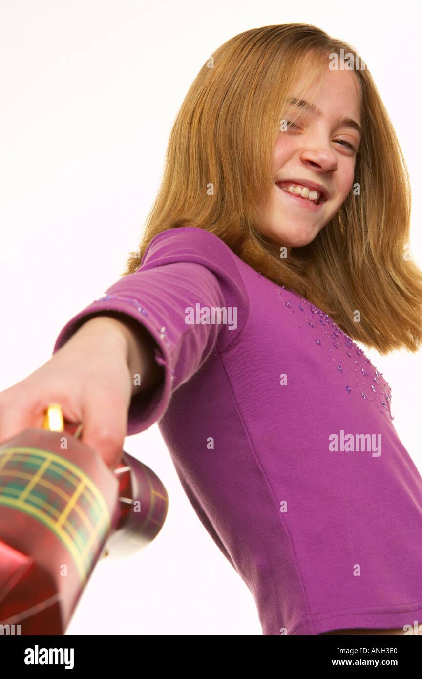 Young white girl pulling christmas cracker Stock Photo Alamy