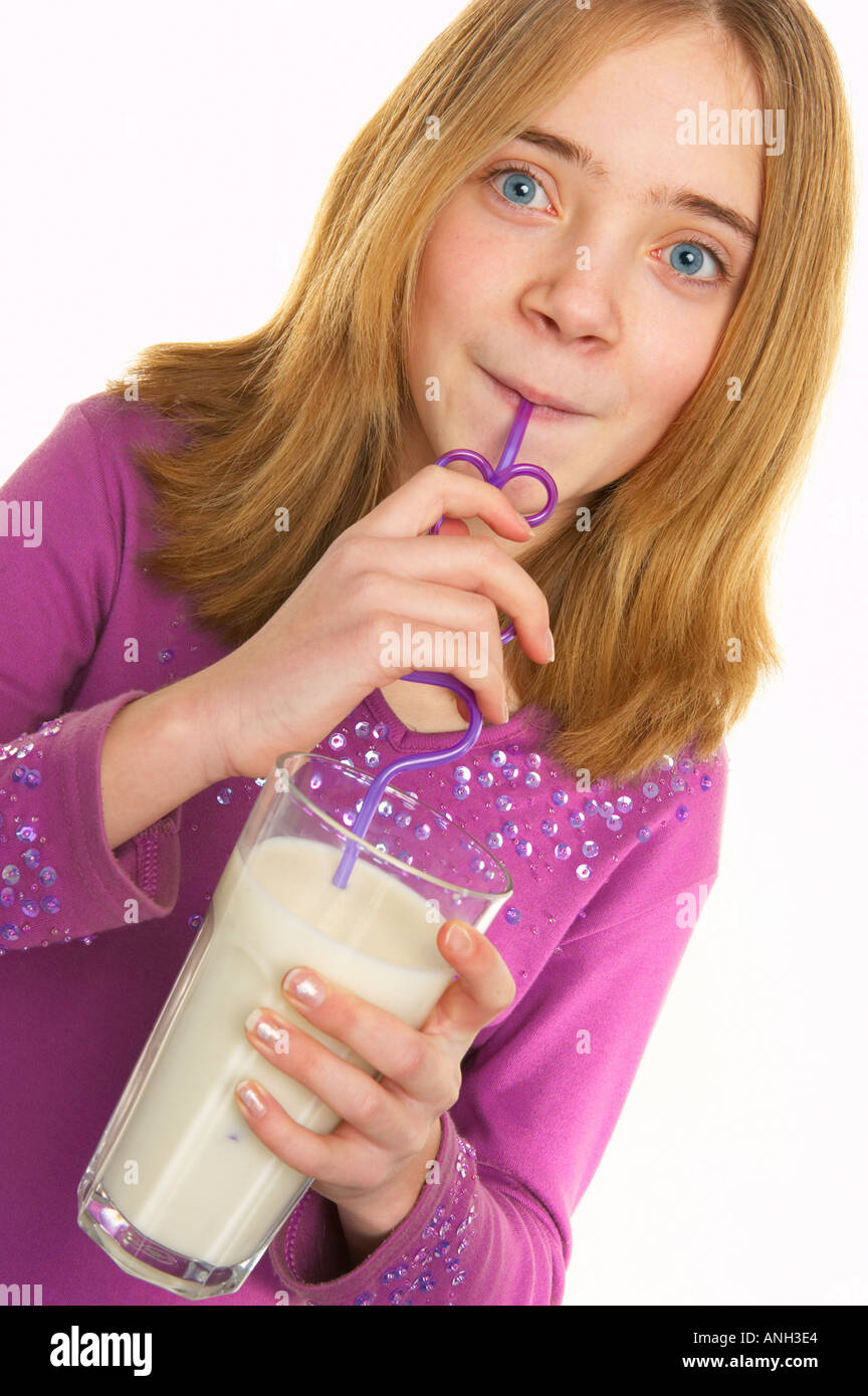 Young white girl drinking milk through silly straw Stock Photo - Alamy