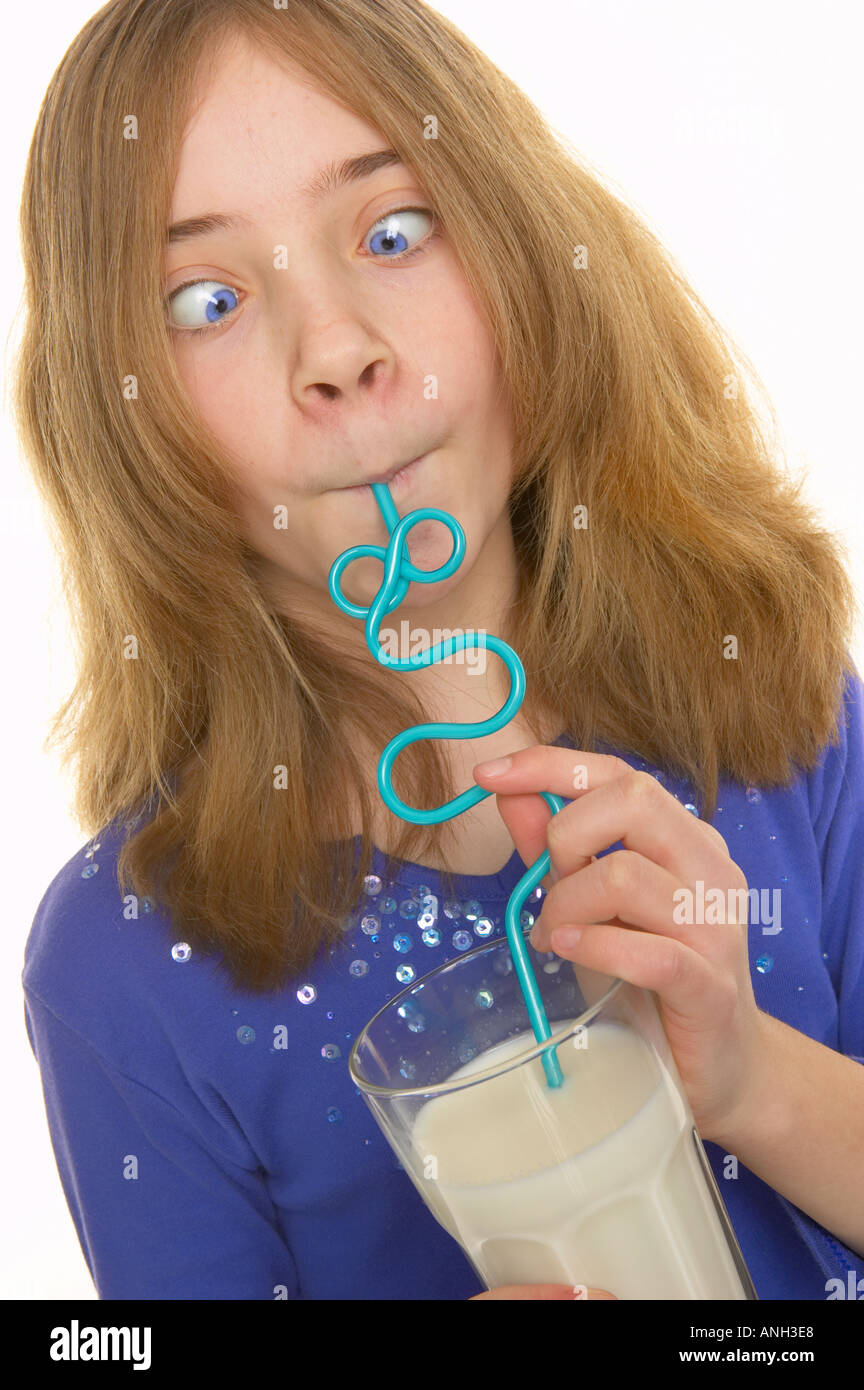 Girl drinking milk through straw hires stock photography and images Alamy