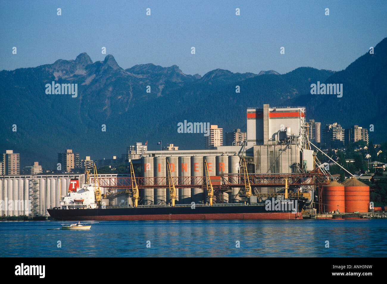 Cargo ship in front of grain dock, British Columbia, Canada. Stock Photo