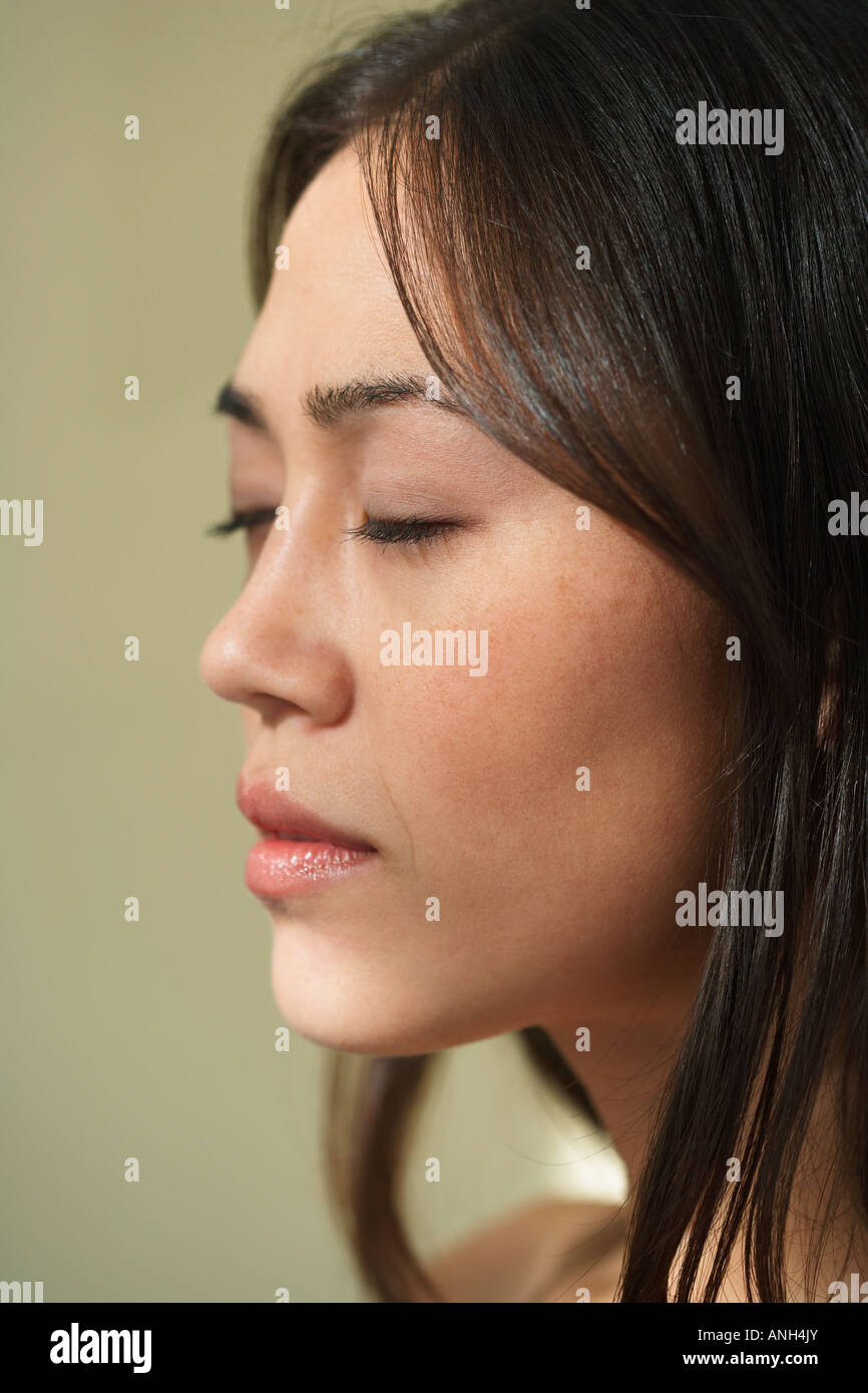 Profile of Asian woman with eyes closed Stock Photo - Alamy