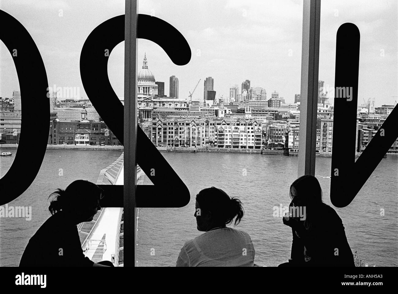 Tate Modern Art Gallery cafe interior with people and city view in London, UK Stock Photo