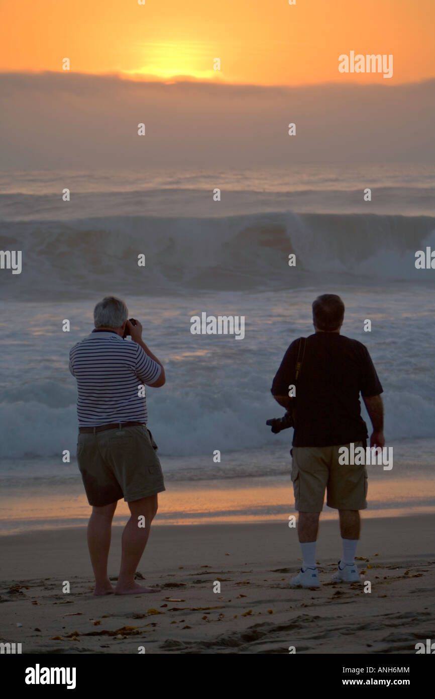 Men photographing Big Waves at Zuma Beach Malibu Los Angeles County California United States Stock Photo