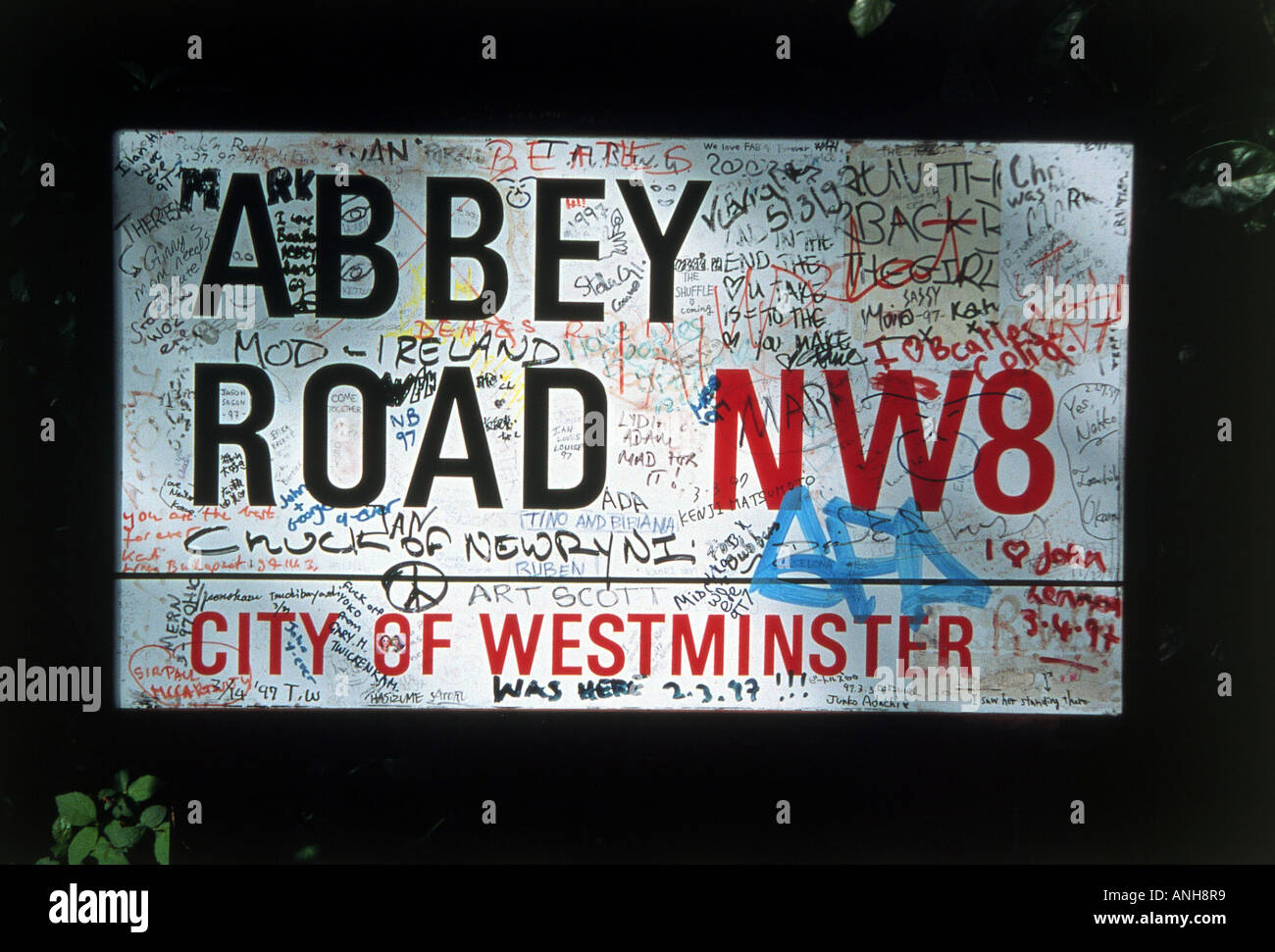 BEATLES Street sign for Abbey Road near the old EMI recording studios used by the Beatles is always covered in graffiti Stock Photo
