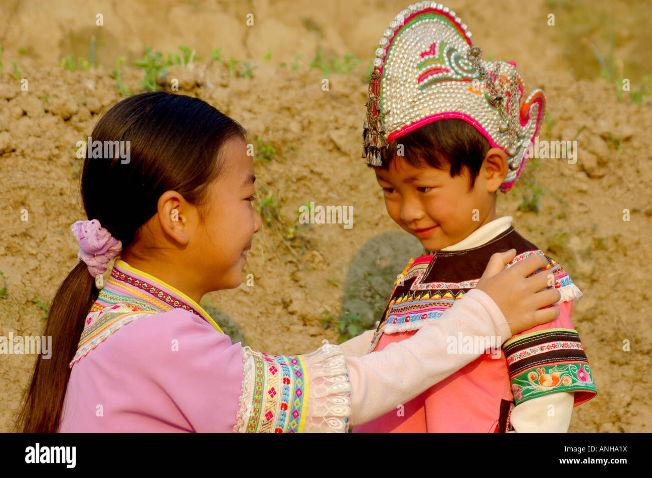 two girl have Yunnan Hani minority traditional clothes go to festival. Stock Photo