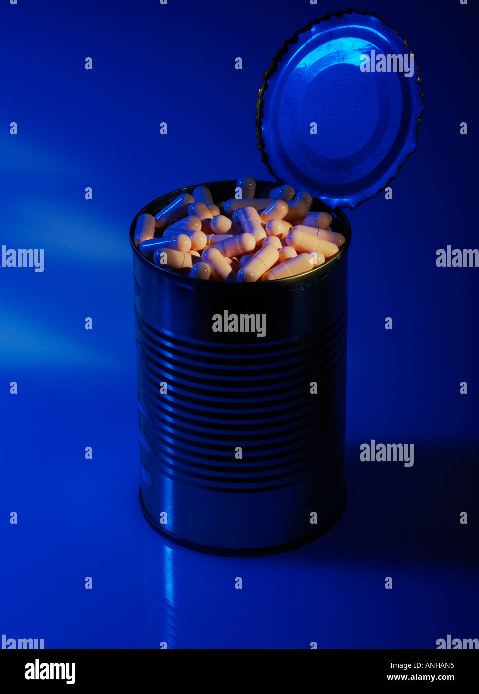 Little Pink Pills in a Tin Can Stock Photo