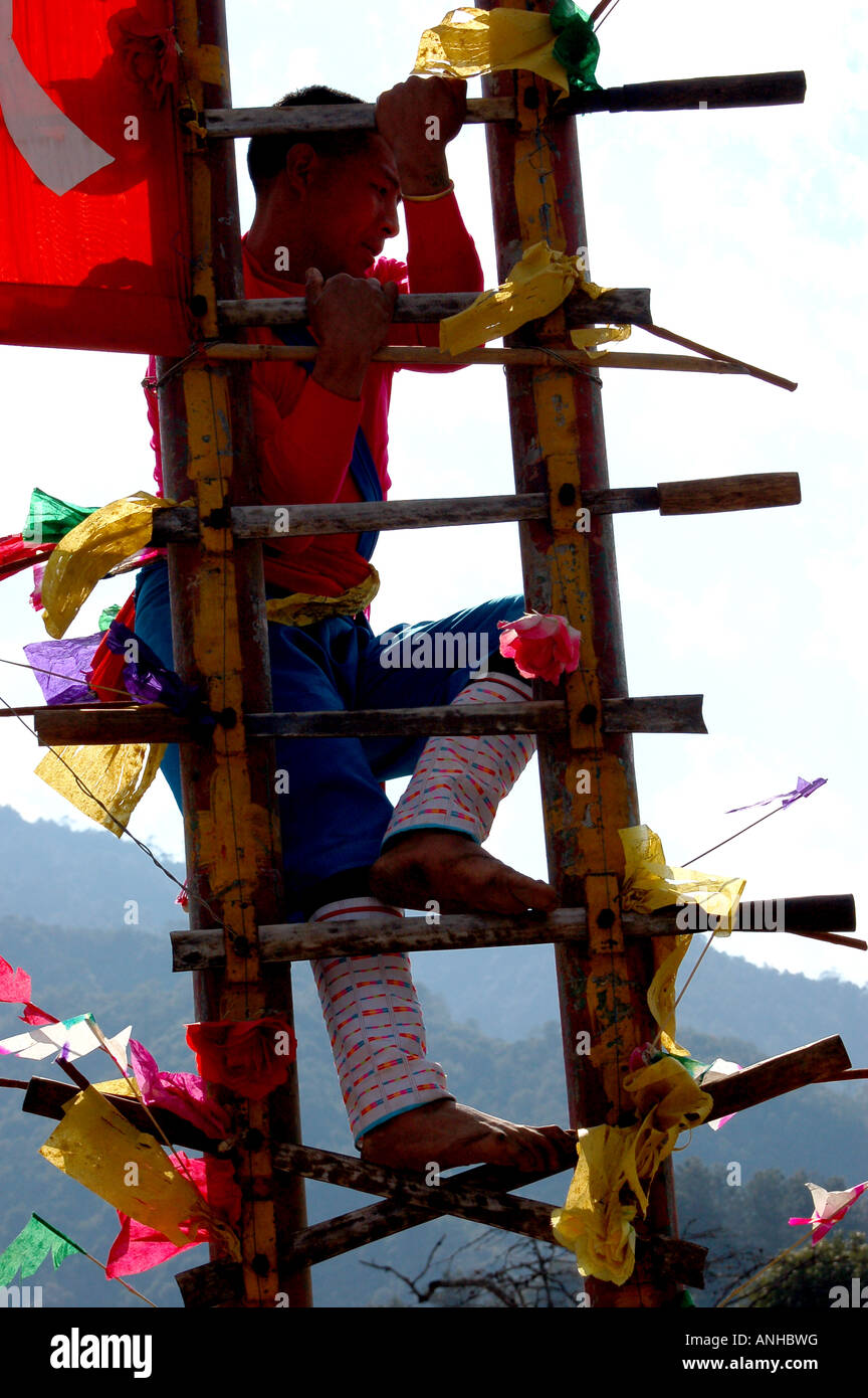 China Yunnan Baoshan lisu minority festival people climb knife Stock Photo