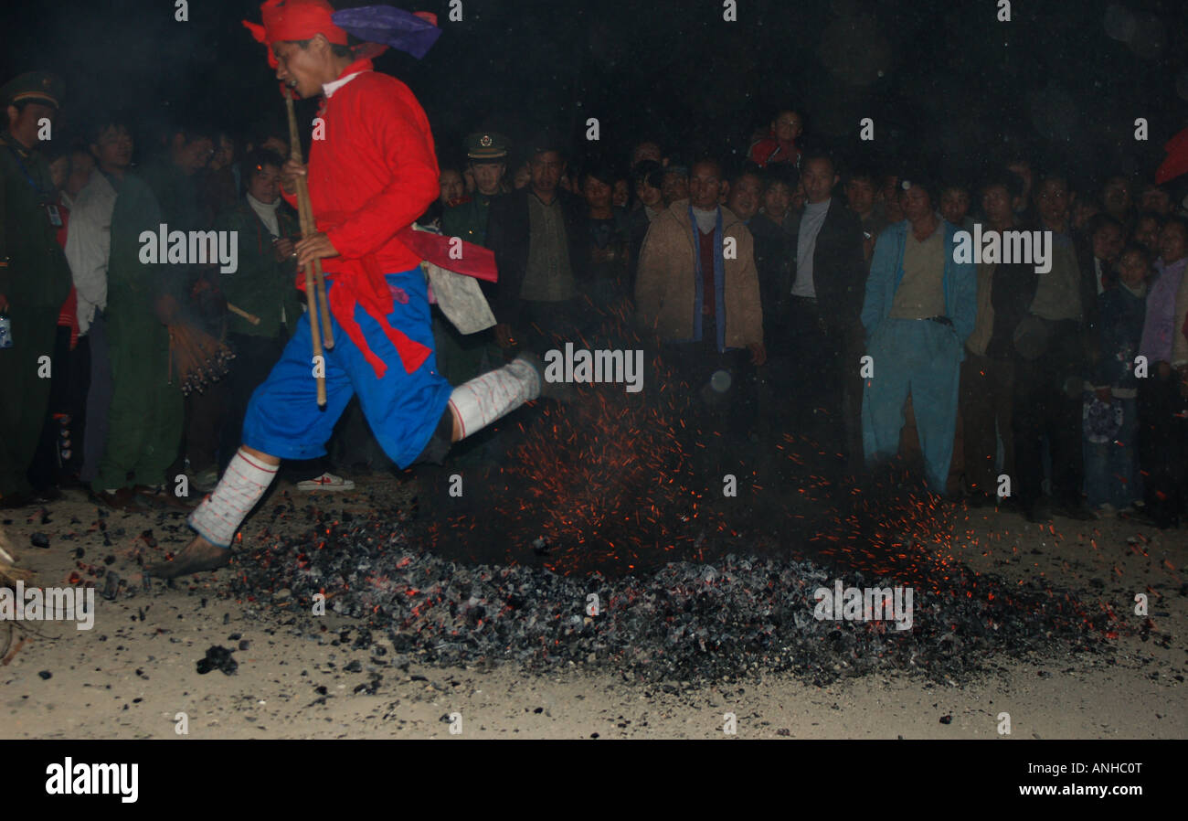 China Yunnan Baoshan lisu minority festival people jump fire Stock Photo