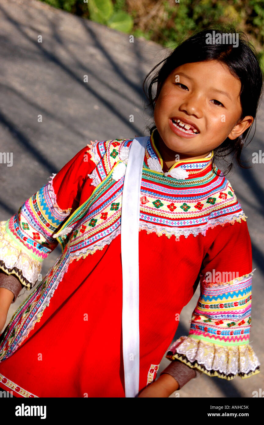 a girl have Yunnan Hani minority traditional clothes go to festival. Stock Photo