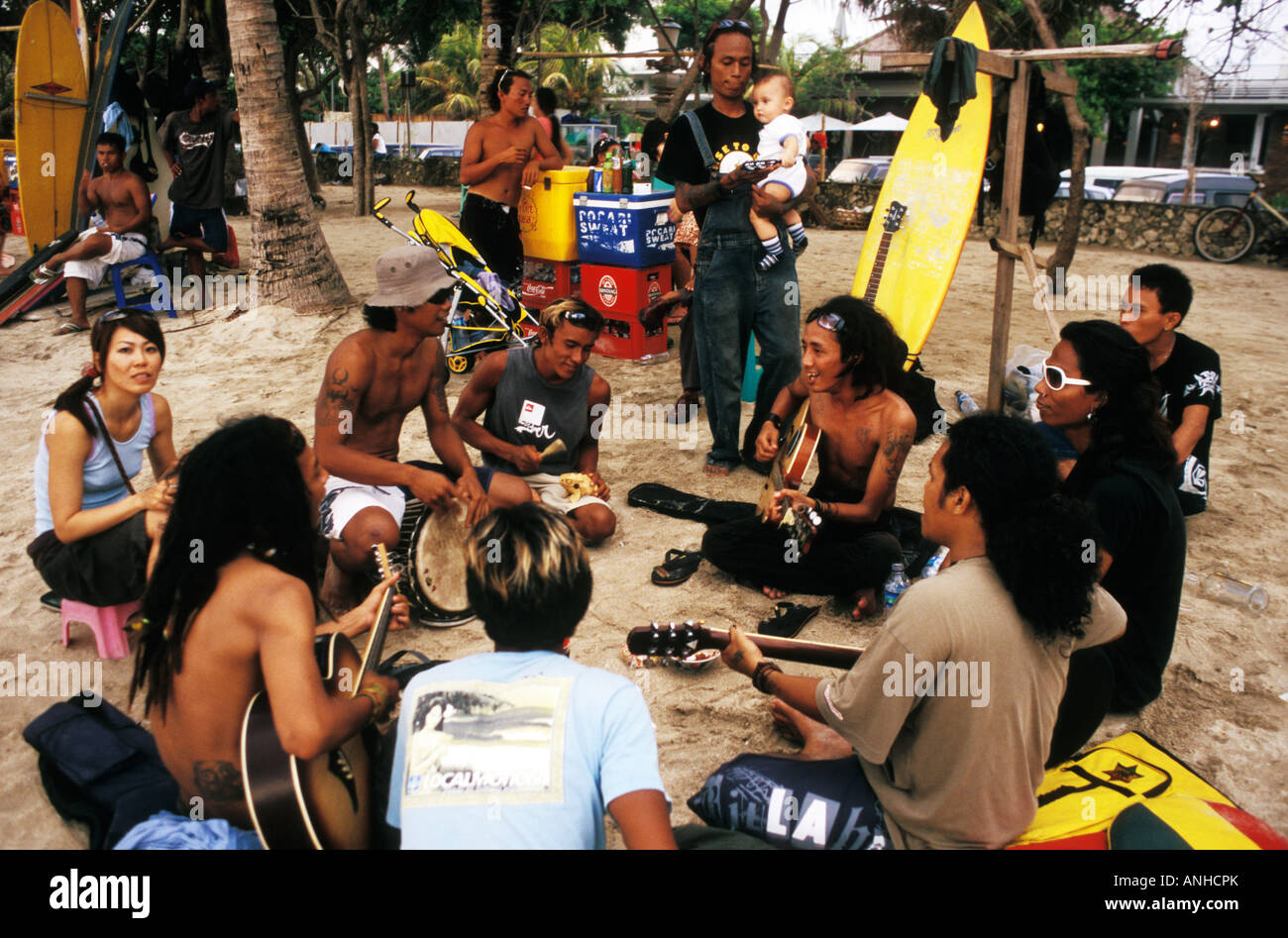 beach touts playing music, kuta beach, bali, indonesia Stock Photo