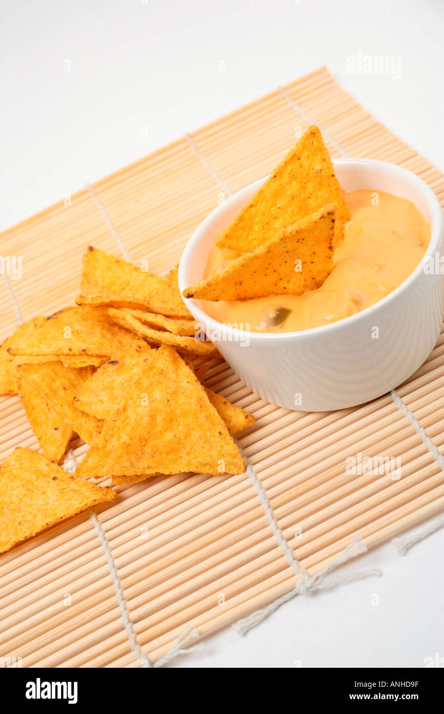 Tortilla chips and cheese dip Stock Photo Alamy